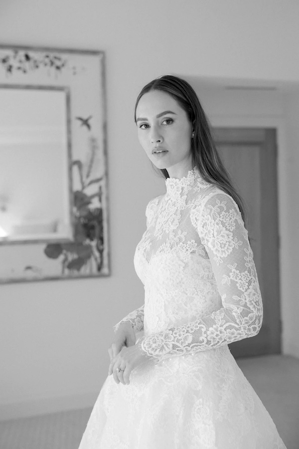 A bride at the Helen Rodrigues wedding dress shop wearing a lace gown