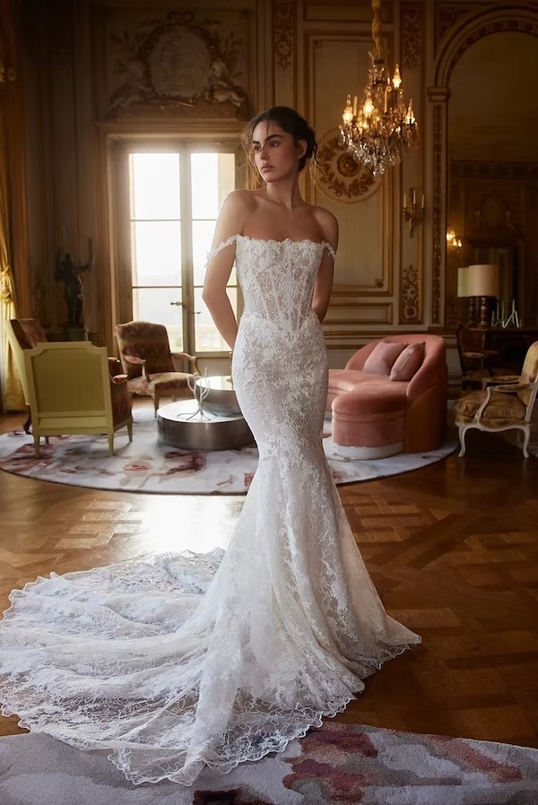 A bride in a luxury room in a fishtail wedding gown
