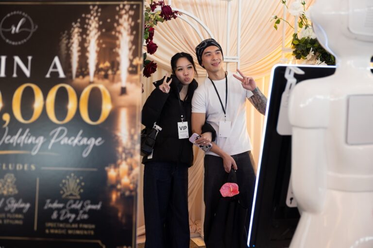 People at a stand at one fine day wedding expo 2026