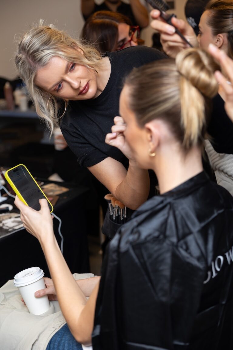 A model getting makeup at one fine day wedding expo 2026