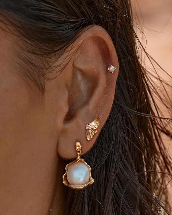 A wedding jewellery bridal ear stack with a large pearl