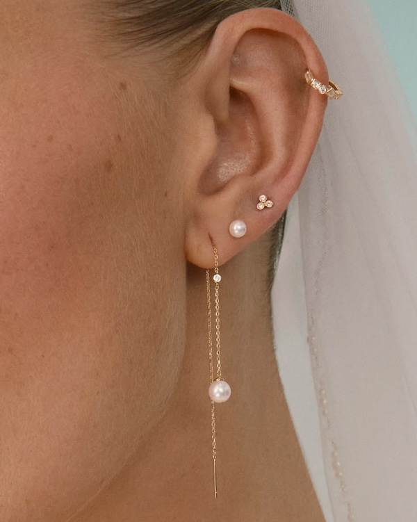 A bridal ear stack with a drop earring