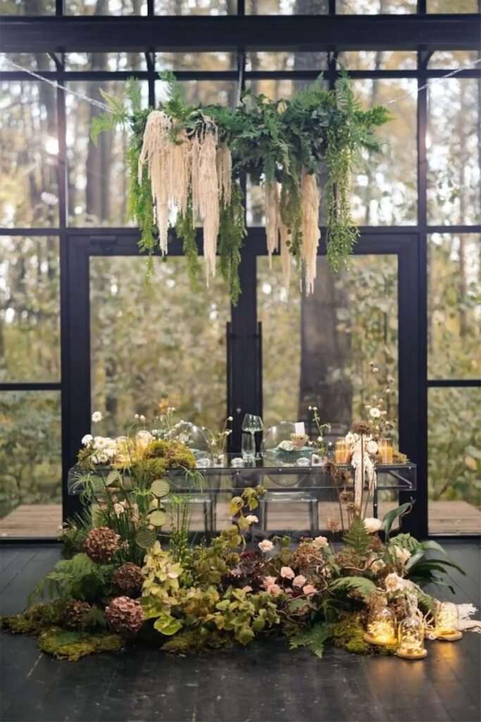 a hanging and floor floral installation at a wedding