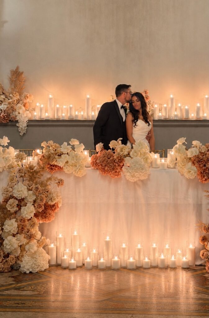 a couple at a wedding with a 2027 floral trend for their decor