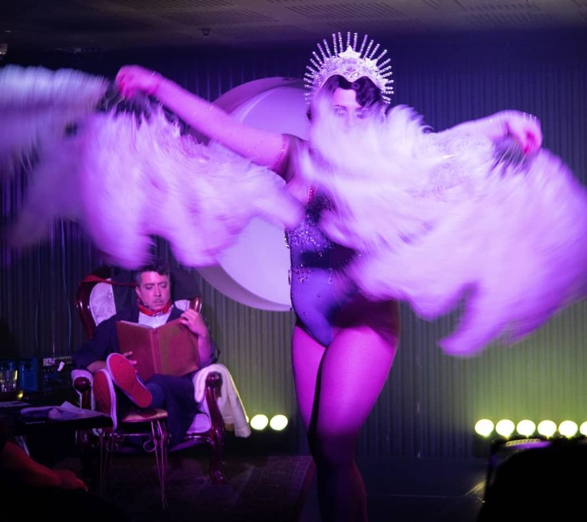 A woman wearing a feathered costume.