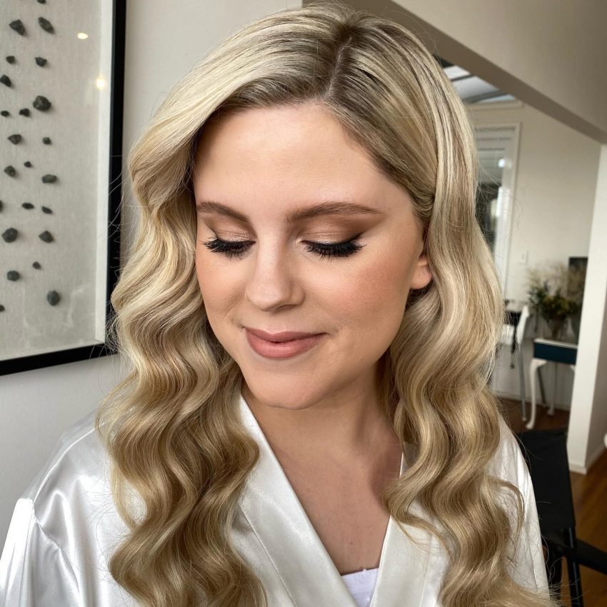 woman getting bridal make-up