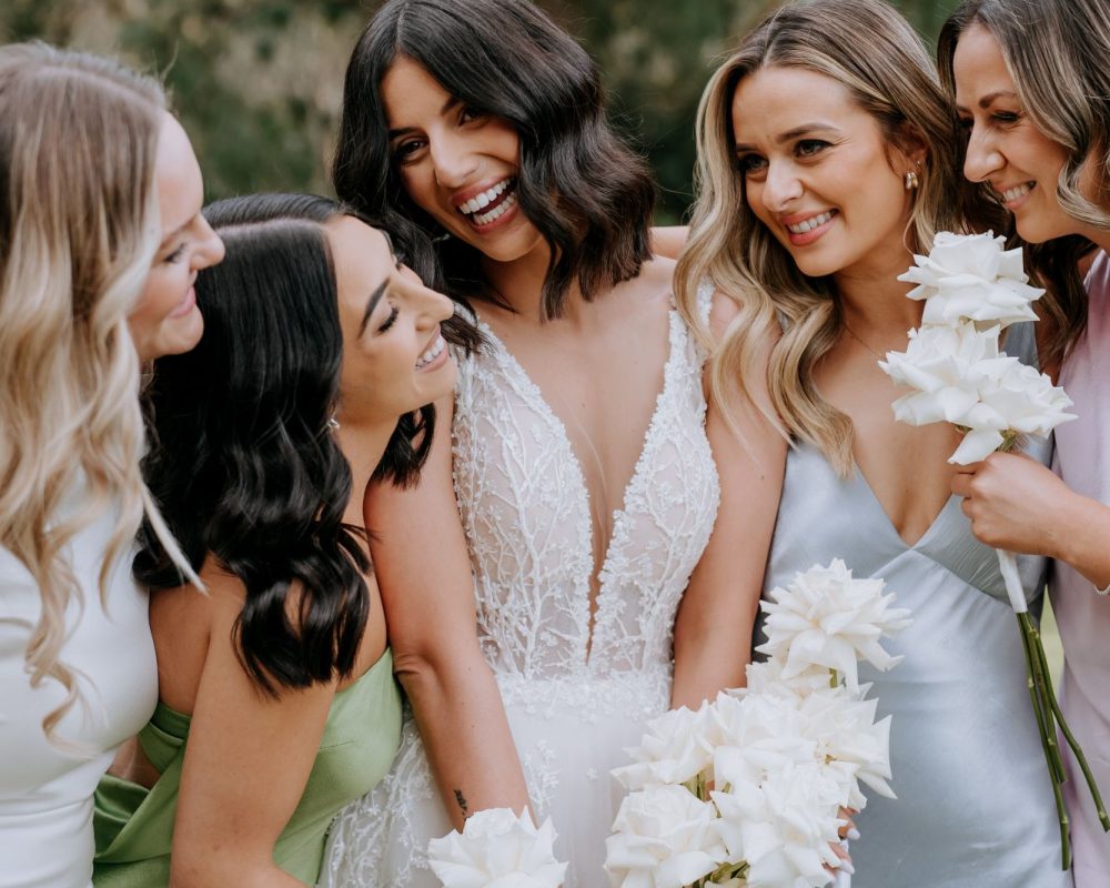Bride and bridesmaids holding matching bouquets designed by Lillypad Flowers Wedding Florist in Melbourne.