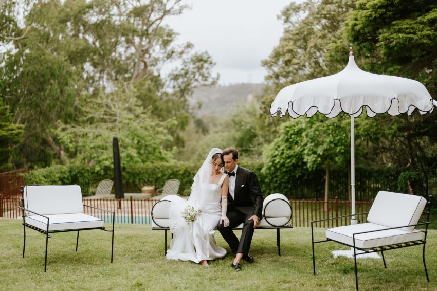 A couple having a wedding portrait in a garden setting