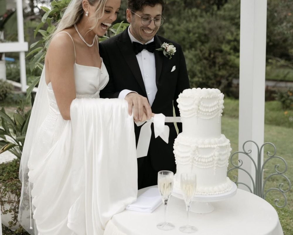 La Petite Tarte, Wedding Cake Supplier in Sydney wedding cake being cut by bride and groom.
