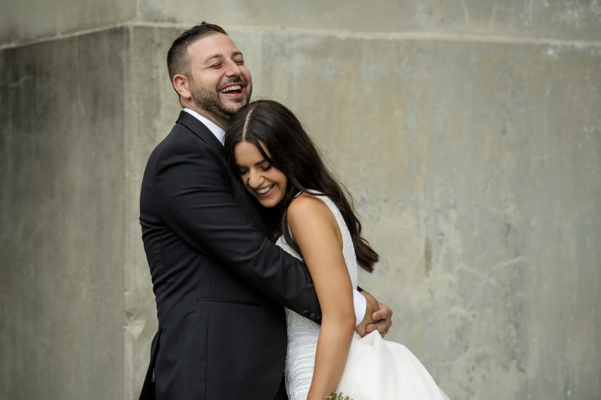 a wedding photo of a couple hugging