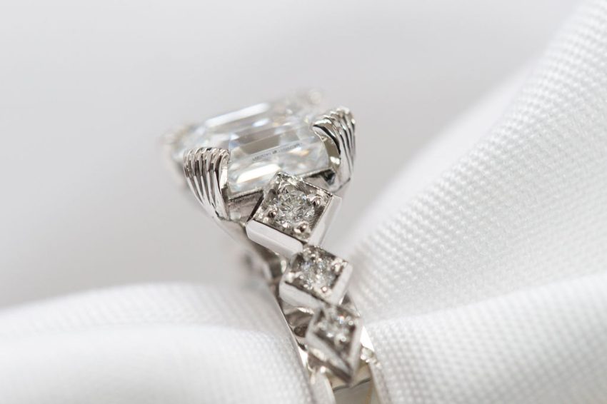 A dazzling silver engagement ring.