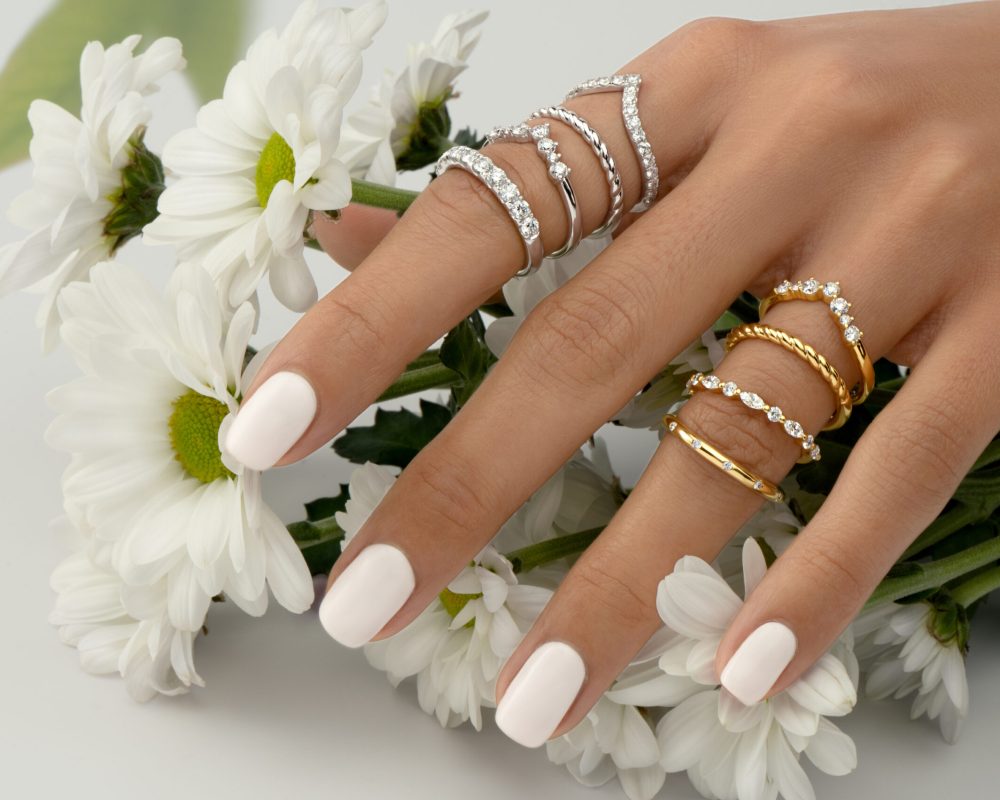 Detailed shot of diamond rings on hand by Novita Diamonds Wedding Jewellery in Australia.