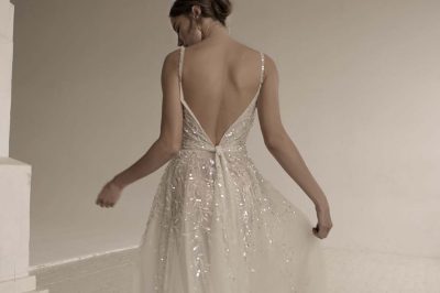 a bride model showing her beautiful backless wedding dress