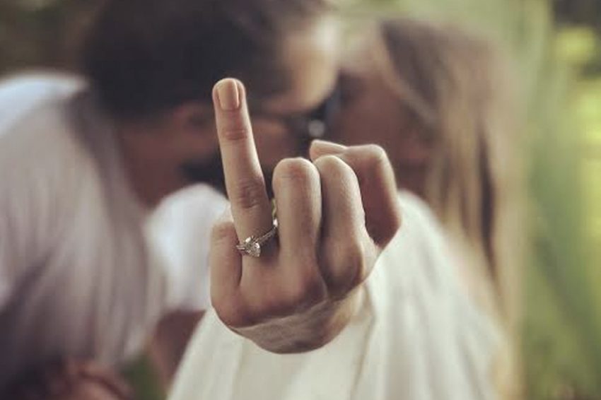 fiance showing up her engagement while kissing each other