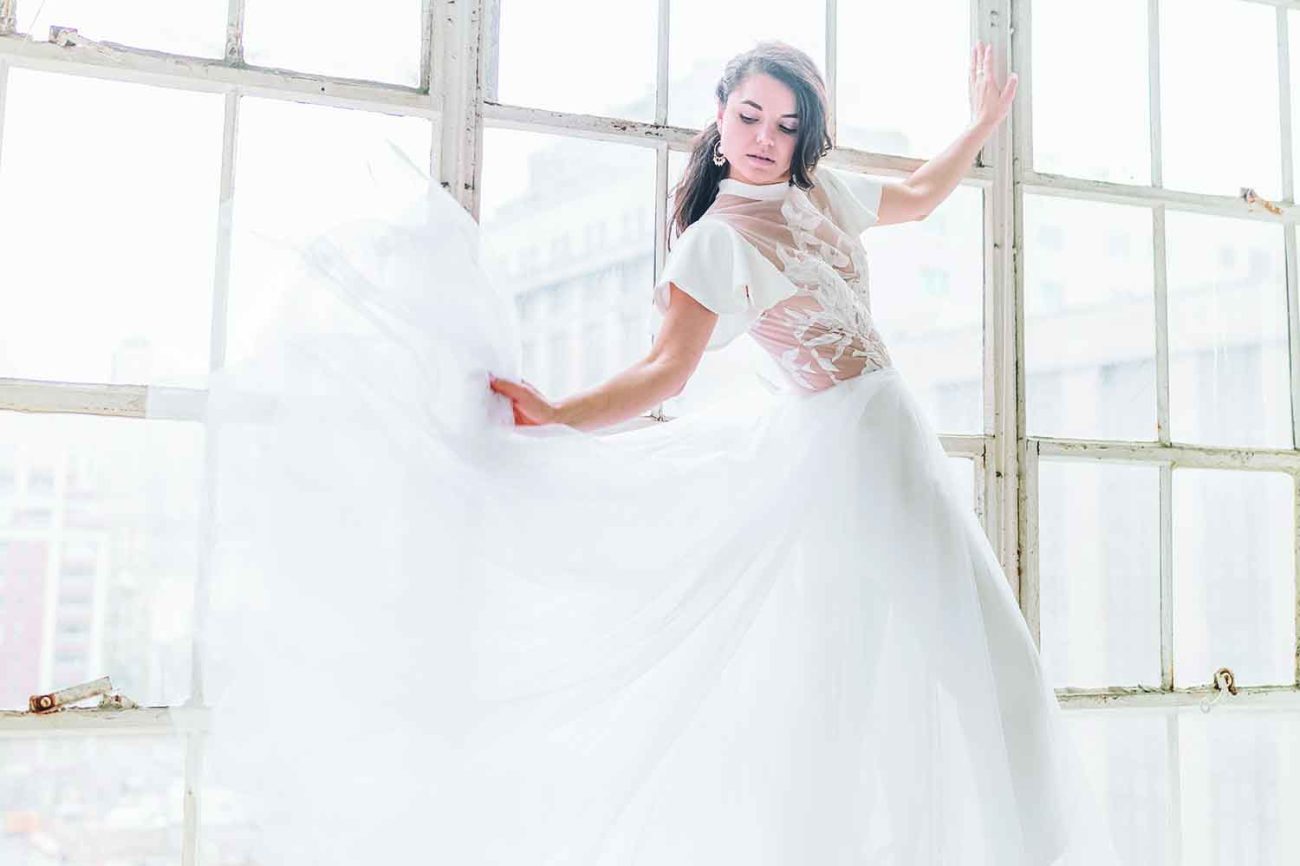 bride model in white flowy wedding dress