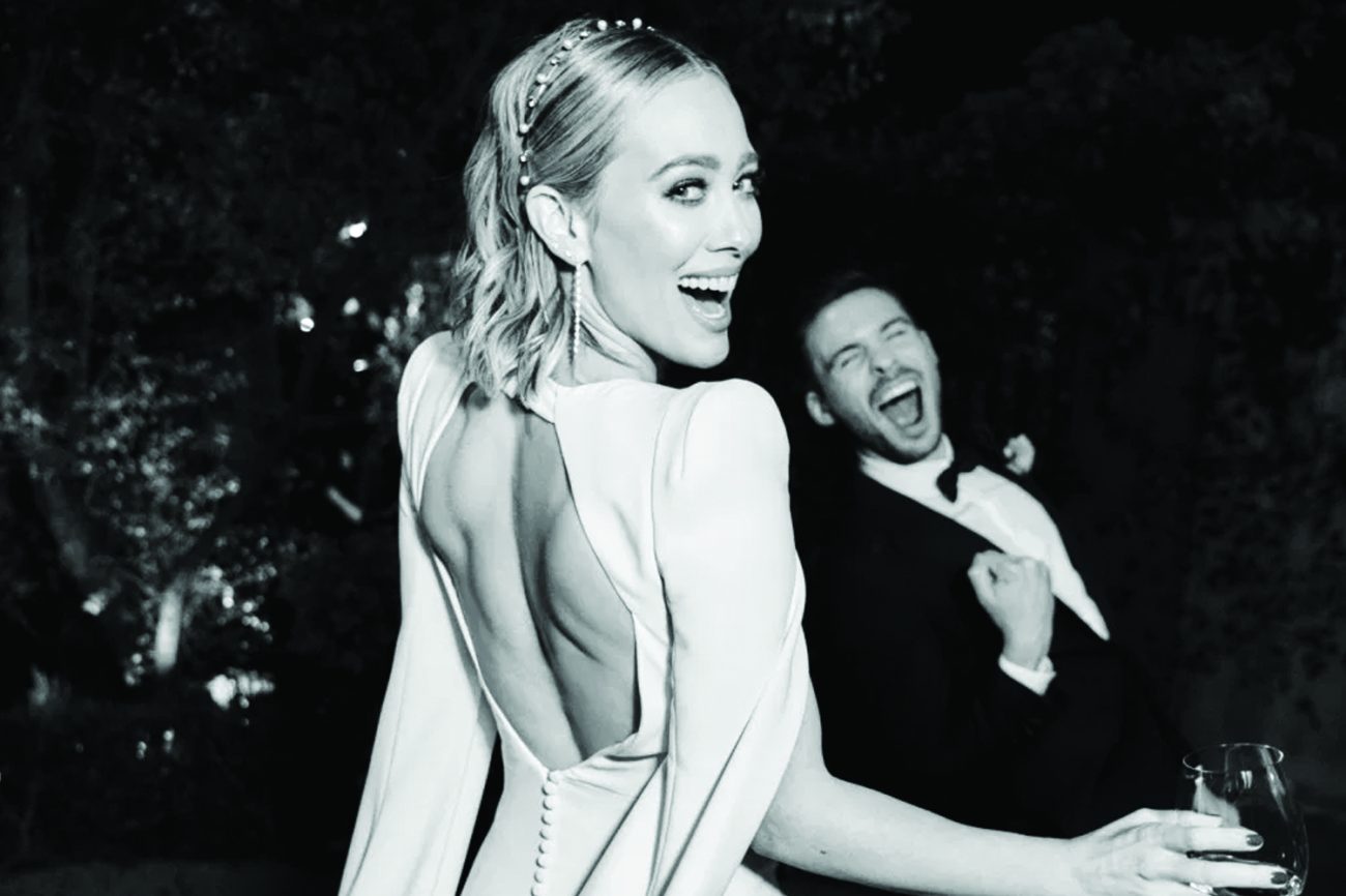 couple singing their hearts out as they played their favorite wedding playlist in black & white photo