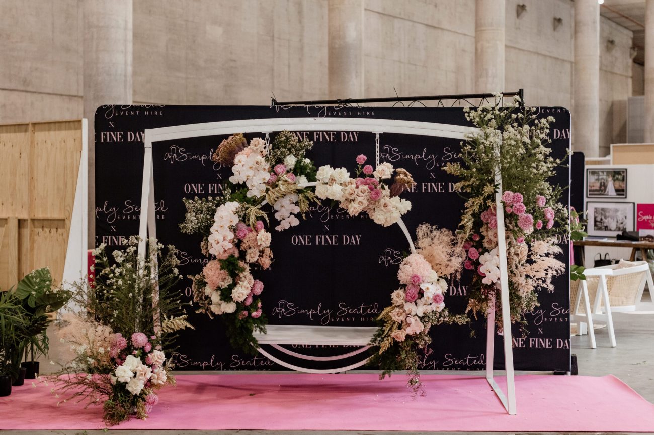 Flower wreath display in a swing at a wedding fair