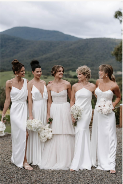 beautiful bride and her bridesmaids posing their elegant Hair and Make-up