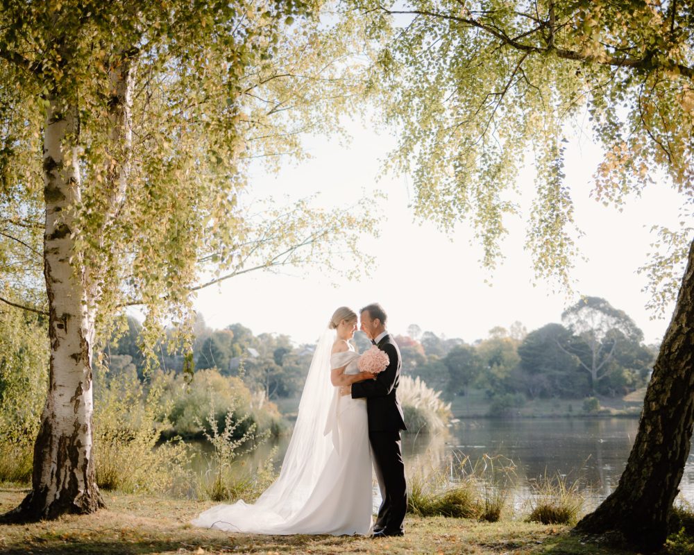 Sweet moment of bride and groom at Lake House Daylesford Lakeside Wedding Venue in Victoria.