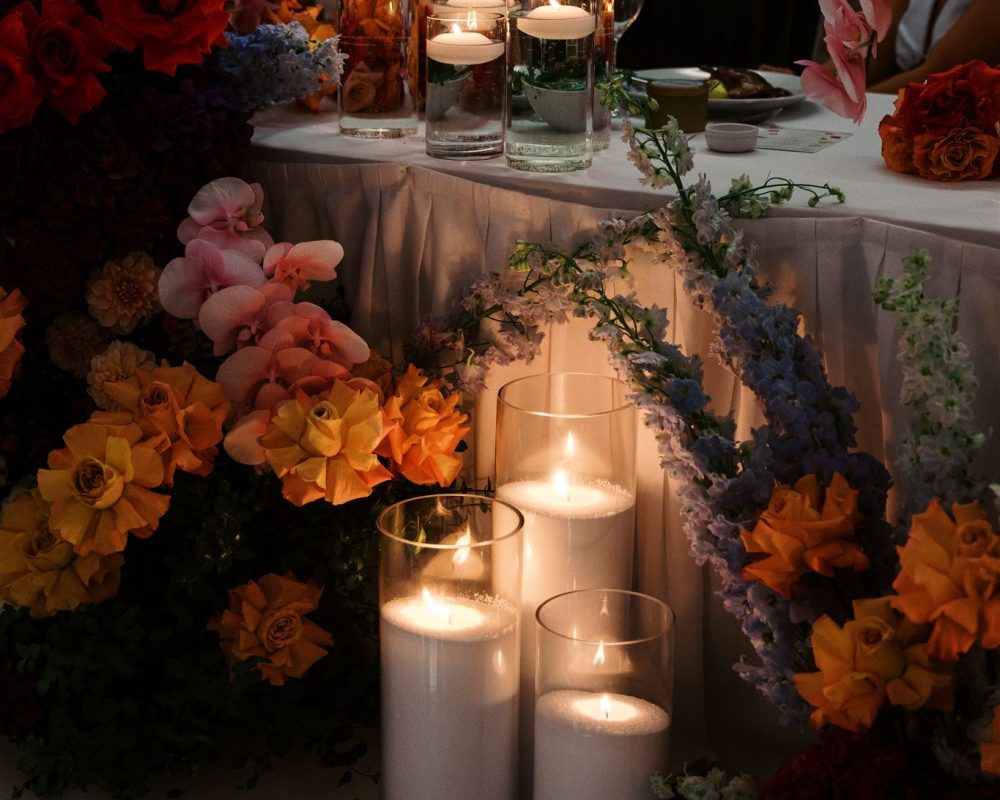 Wedding reception table styled with three floor candles by Catherine Matilda Wedding Candles Styling in Sydney.