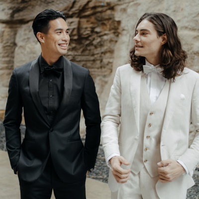 Groom In All Black Suit and All White Suit