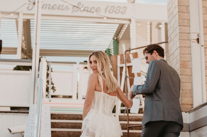 couple checking wedding venue taking the stairs