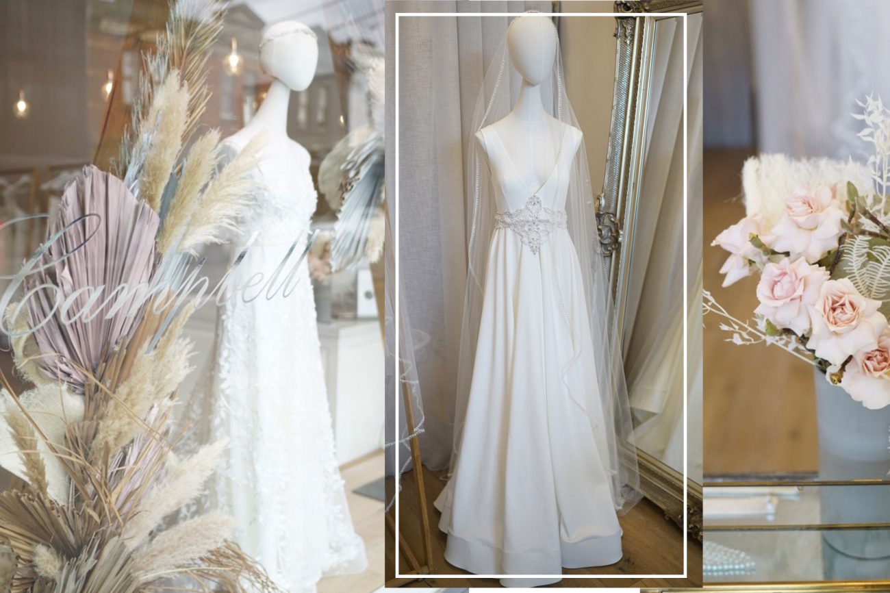 Wedding Gown with Decorative Flowers displayed in a wedding shop