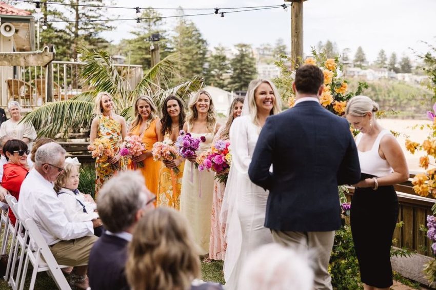 Couple saying their wedding vows infront of their guests.